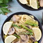 Lemon Parsley Angel Hair with Asparagus and Mushrooms garnished with fresh lemons
