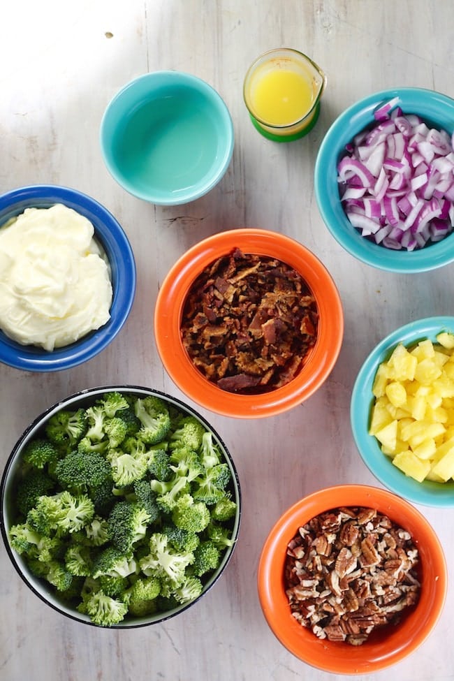 Ingredients for broccoli pineapple salad: broccoli, pineapple, pecans, bacon, red onion, mayo, white wine vinegar, orange juice