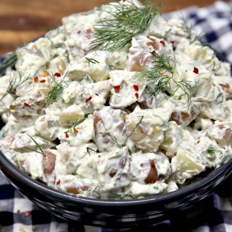 Bowl of potato salad with creamy dill dressing.