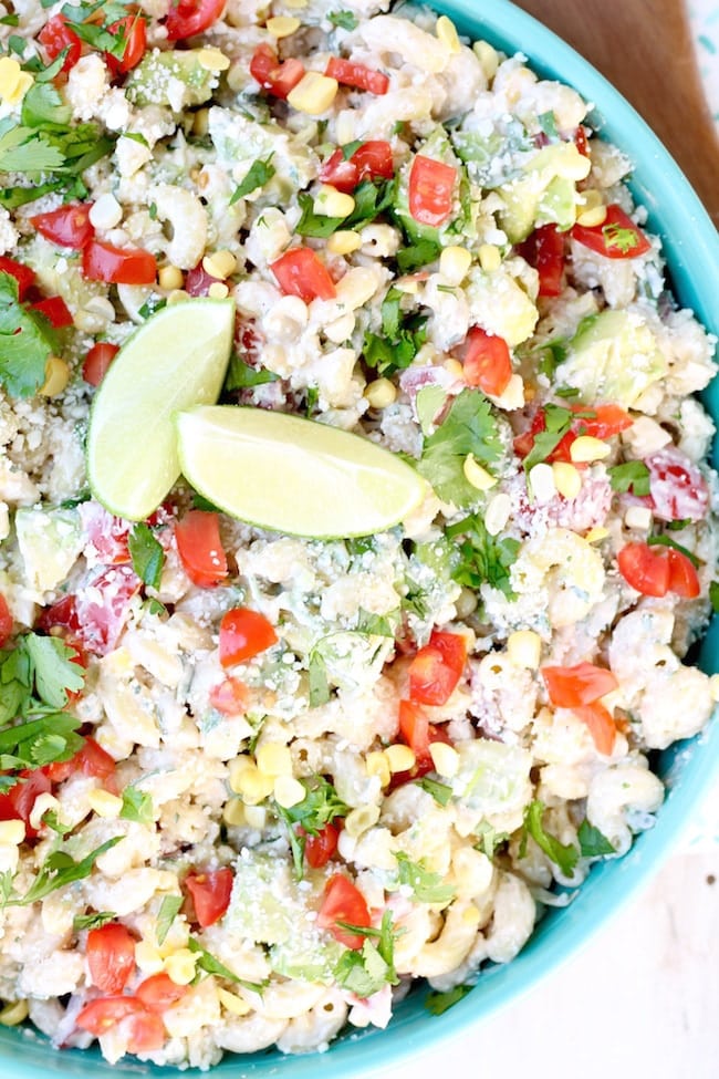 Mexican Street Corn Pasta Salad with lime, cilantro, corn, tomatoes and avocados