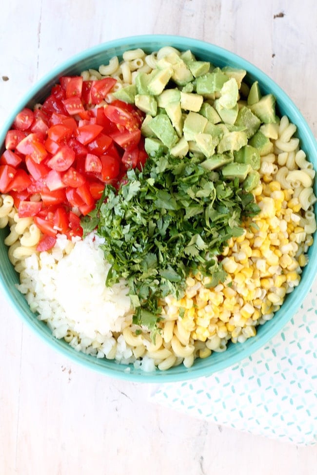 Easy Mexican Street Corn Pasta Salad with fresh corn, avocados, tomatoes and vidalia onions
