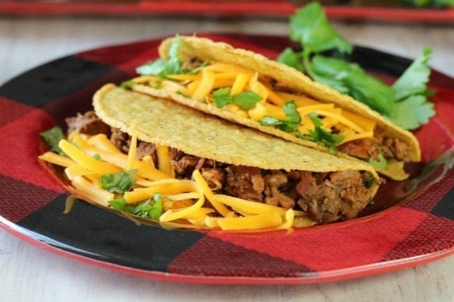 Brisket Tacos on a red palte.