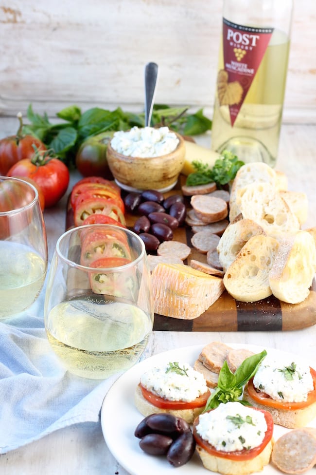 Charcuterie & Fresh Tomato and Herbed Ricotta Bruschetta with wine 