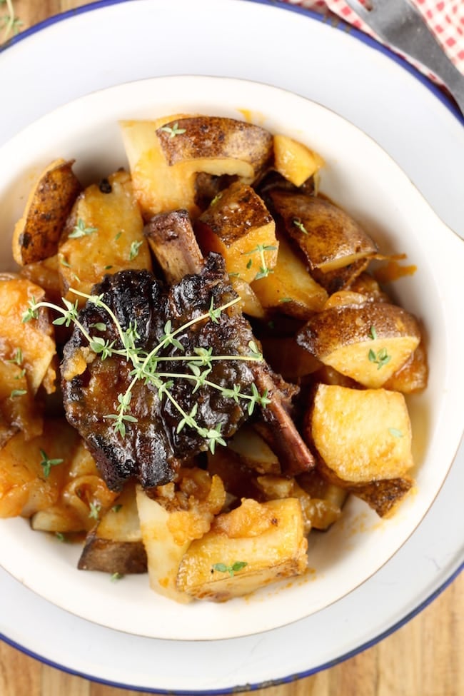 Plated Dutch Oven Short Ribs with Potatoes and Onions slow cooked over a campfire