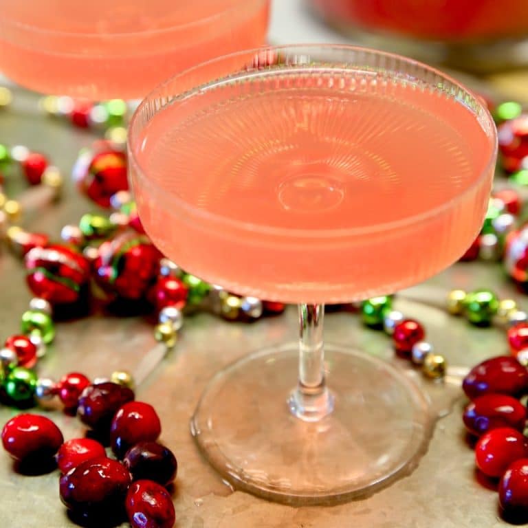 Closeup of cosmopolitan punch in a coupe glass.
