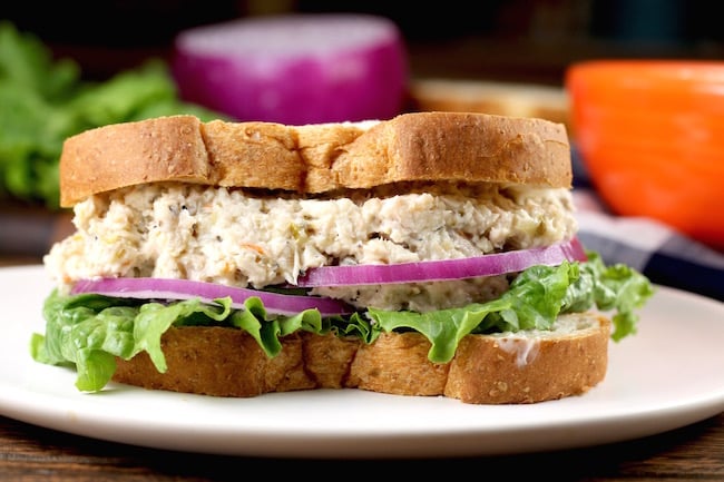 Turkey Salad Sandwich with lettuce and red onion on wheat bread