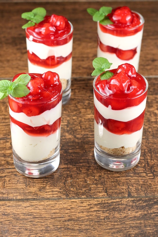 Cherry Cream Cheese Pie Shooters with fresh mint garnish
