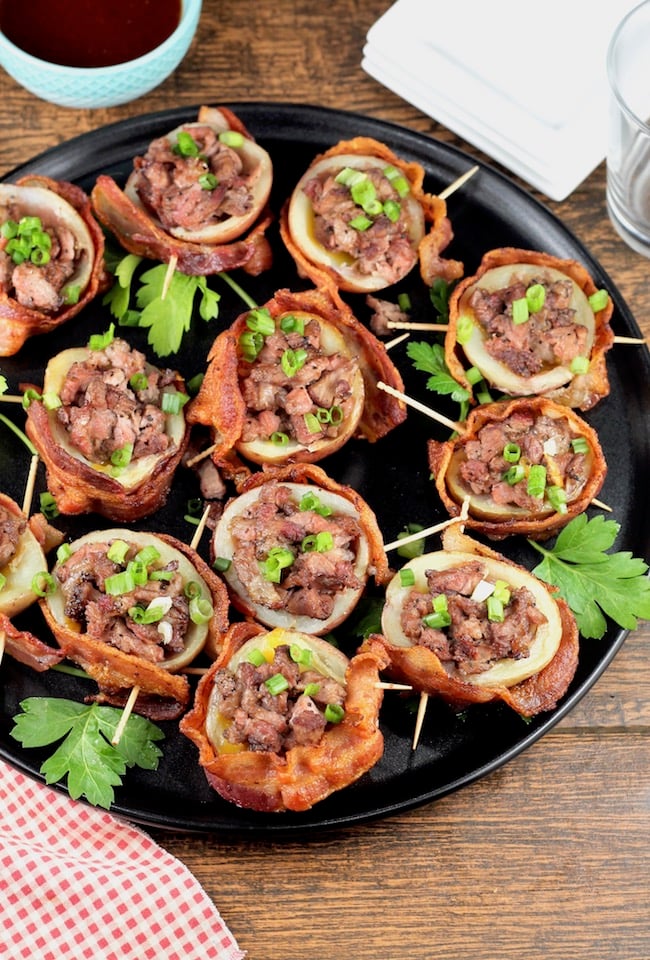 Loaded Potato Skins wrapped in bacon and stuffed with smoked roast beef and cheese