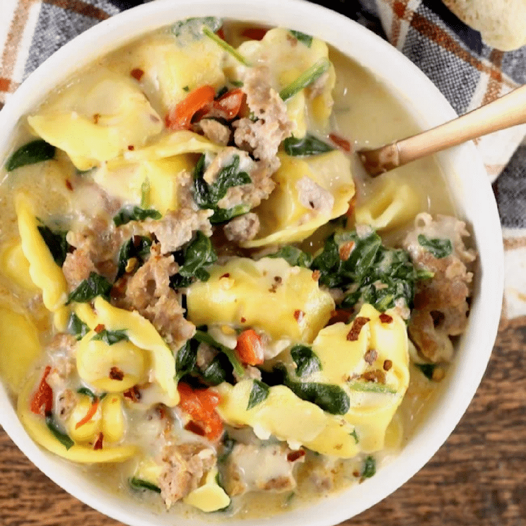 Overhead view of bowl of tortellini soup.
