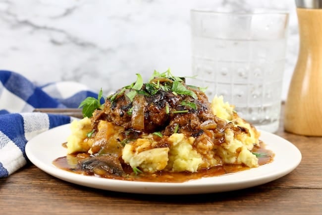 Homemade Salisbury Steak served over Mashed Potatoes