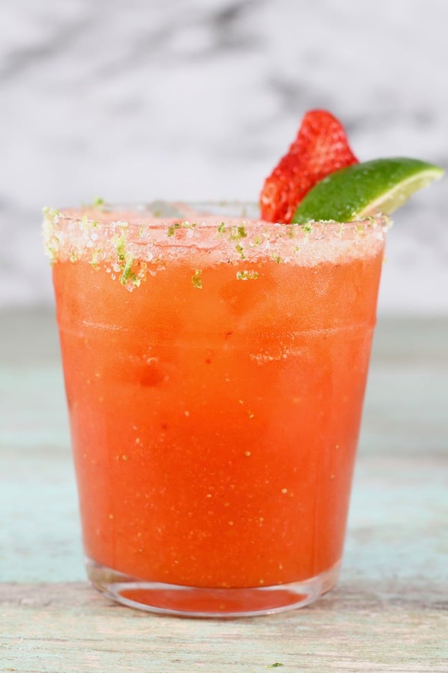 Strawberry Margarita garnished with salt & lime zest rim