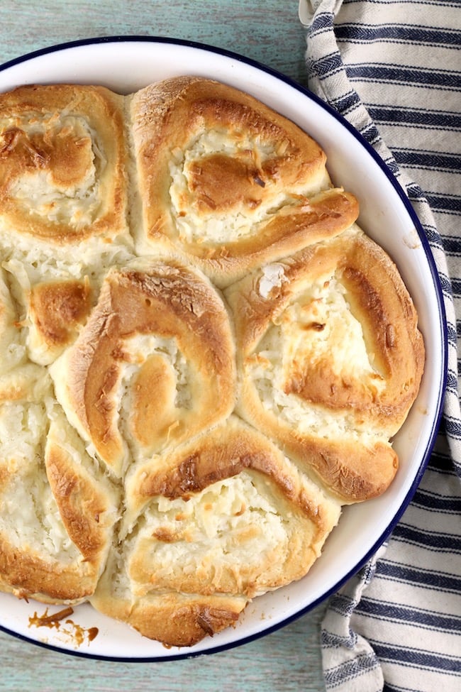 Coconut Cream Pie Sweet Rolls are the ultimate morning treat. Fluffy sweet rolls filled with coconut cream filling and baked to perfection. A great addition to a holiday brunch or weekend breakfast spread. Coconut Cream Pie Sweet Rolls