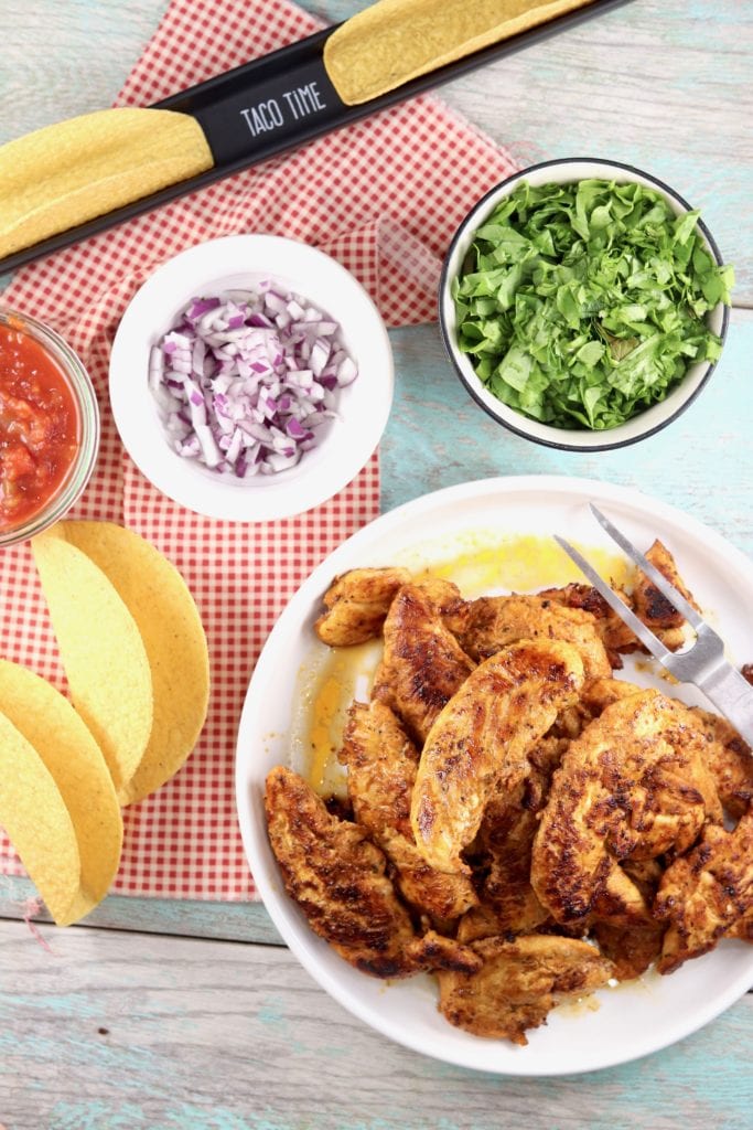 Blackened Chicken, taco shells, lettuce, red onions and salsa