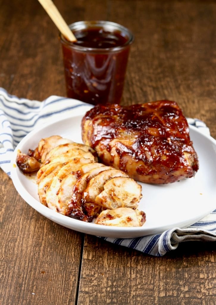 Grilled Barbecue Chicken, sliced and whole with barbecue sauce