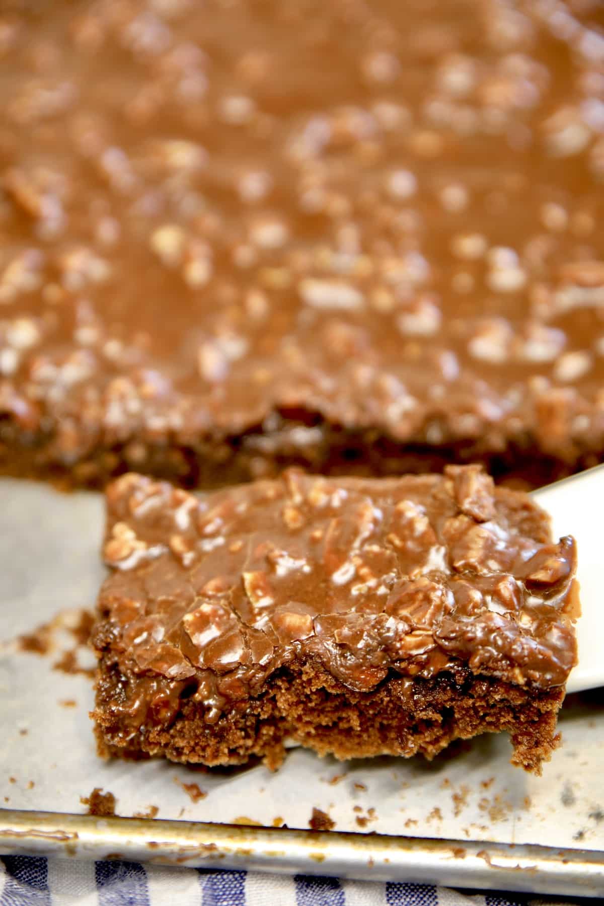 Texas Sheet Cake, slice on spatula.