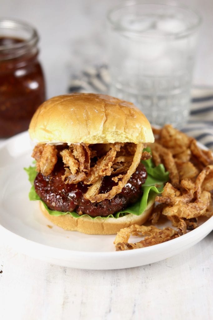 Burgers grilled and basted in homemade barbecue sauce