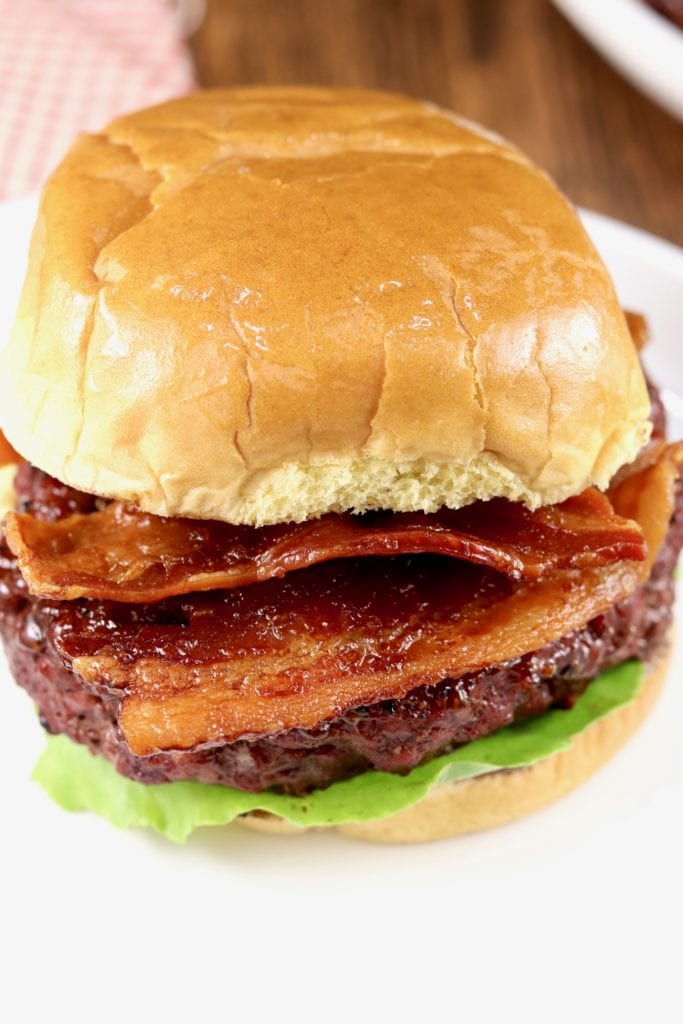 grilled barbecue burger and topped with crispy bacon