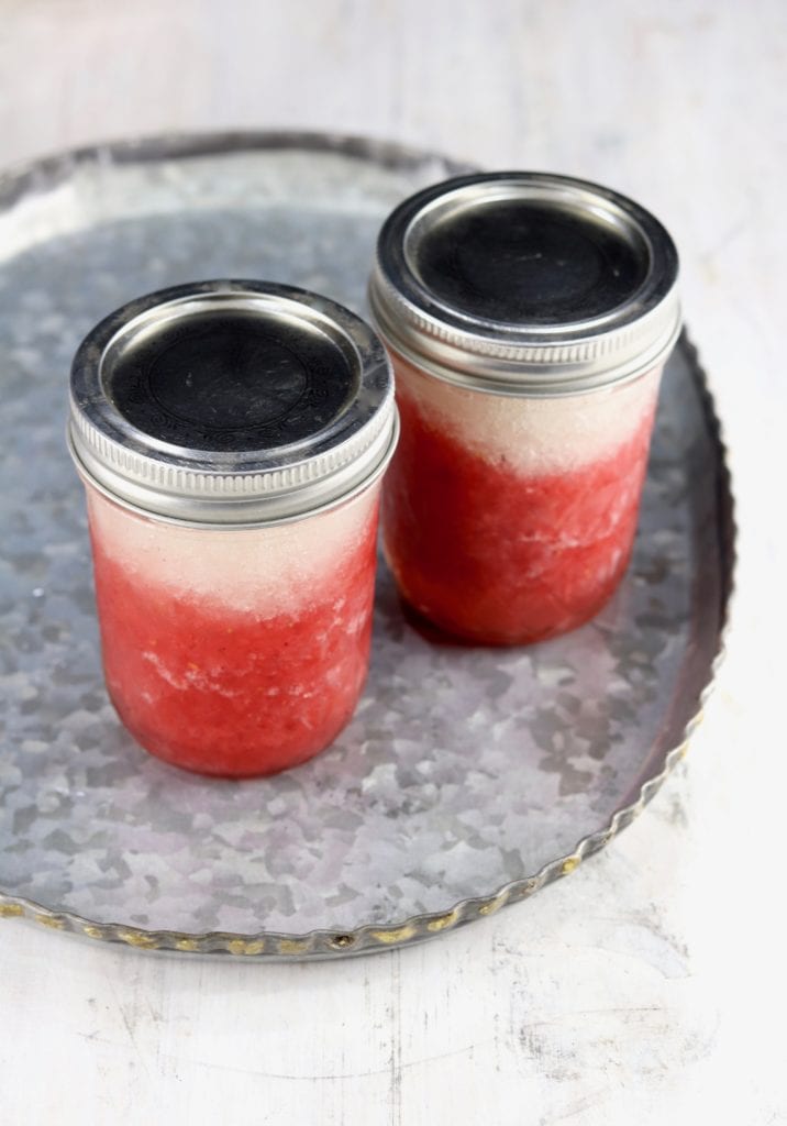 Mason jars of layered daiquiris 