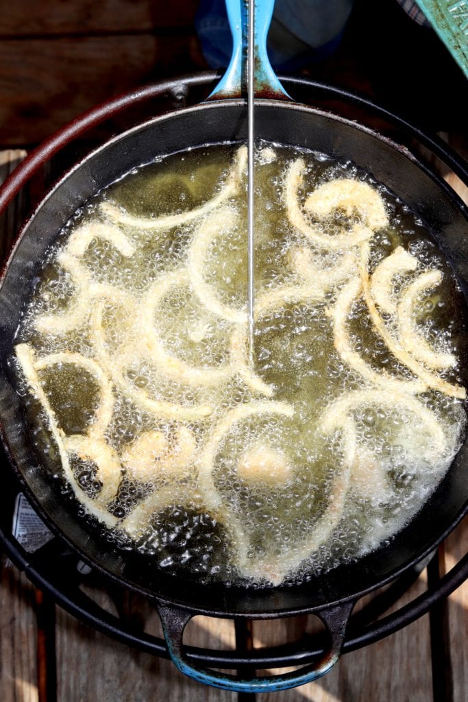 Easy Onion Strings frying in a skillet