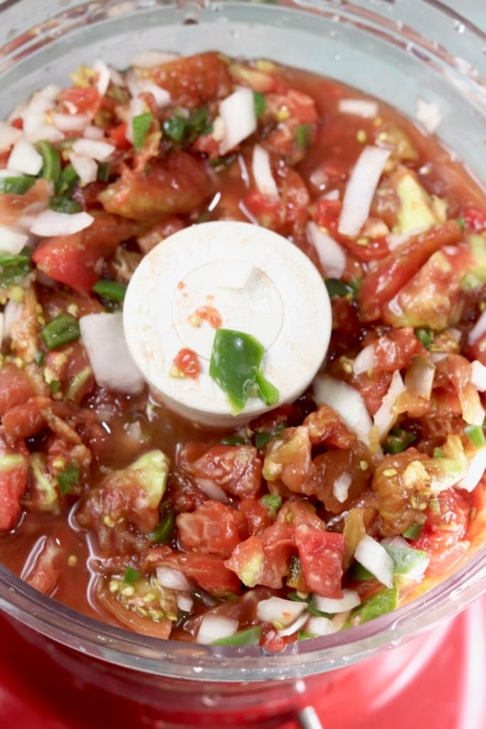 Food Processor with chopped tomatoes, jalapenos and onions
