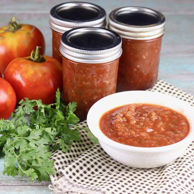 Homemade salsa jars and bowl.