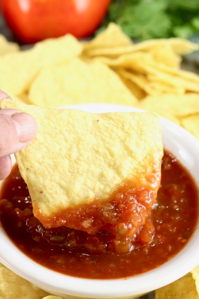 Tortilla Chip dipping in Salsa