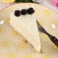 Slice of Lemon chiffon dessert garnished with blackberries