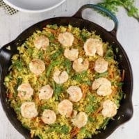 Cast iron skillet with fried rice with shrimp