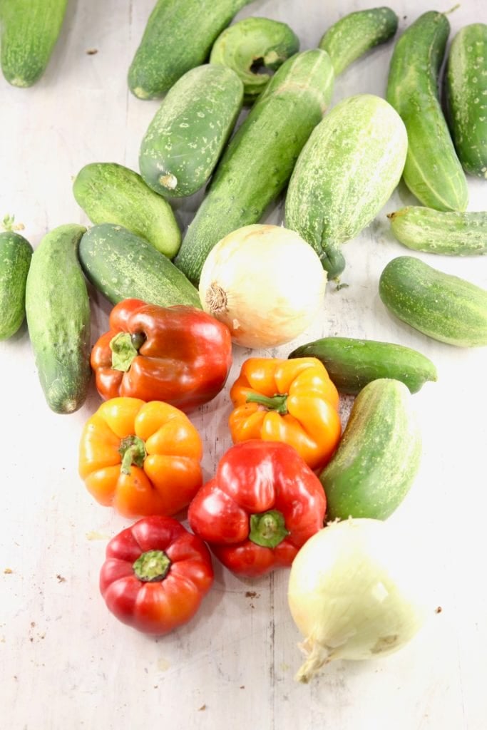 Cucumbers, Red and Yellow Peppers, Onions on a white board