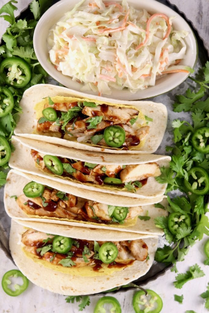 Barbecue Chicken Tacos with coleslaw on a platter