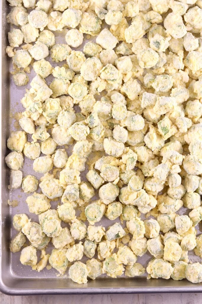 Sheet pan of battered okra for frying