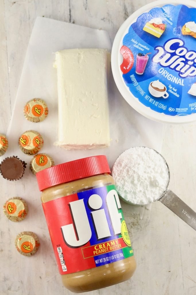 Cream Cheese block, powdered sugar, peanut butter, cool whip and mini peanut butter cups 