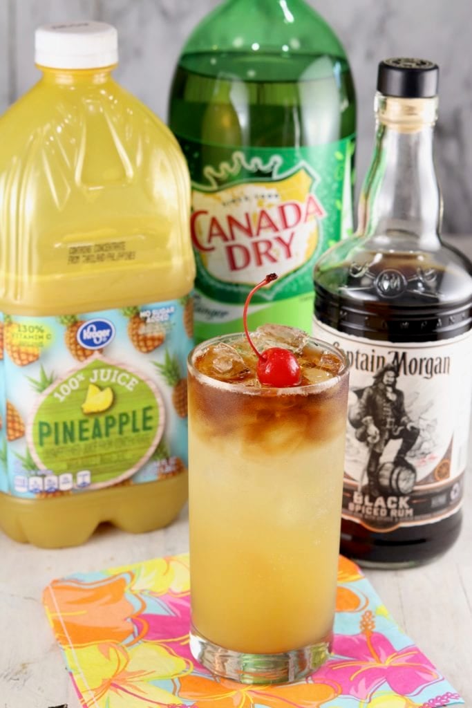 Pineapple Juice, Ginger Ale, Black Rum with glass of rum punch