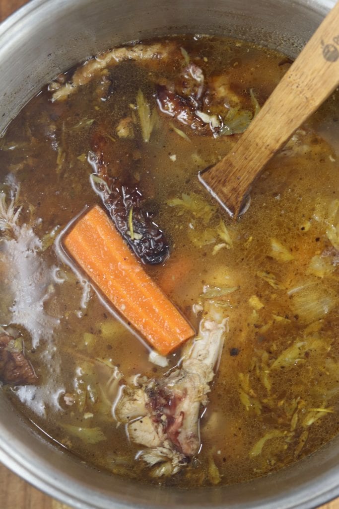 Rich turkey stock in stockpot