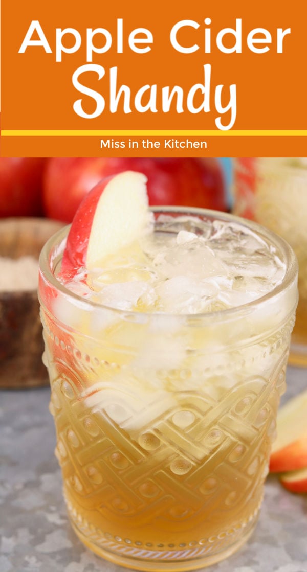 Fall cocktail with apple cider and apple slice garnish