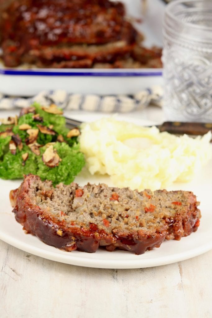 Plate of sliced meatloaf, broccoli and mashed potatoes