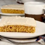 Slice of pumpkin cake and cup of coffee