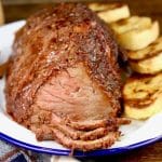 Rump roast on a plate with toasted bread.