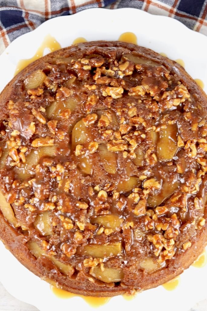 Caramel Apple and Walnut Upside Down Cake on a white cake plate