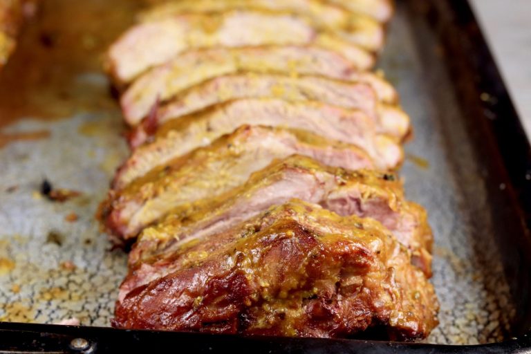 Baby Back Ribs sliced on a baking sheet
