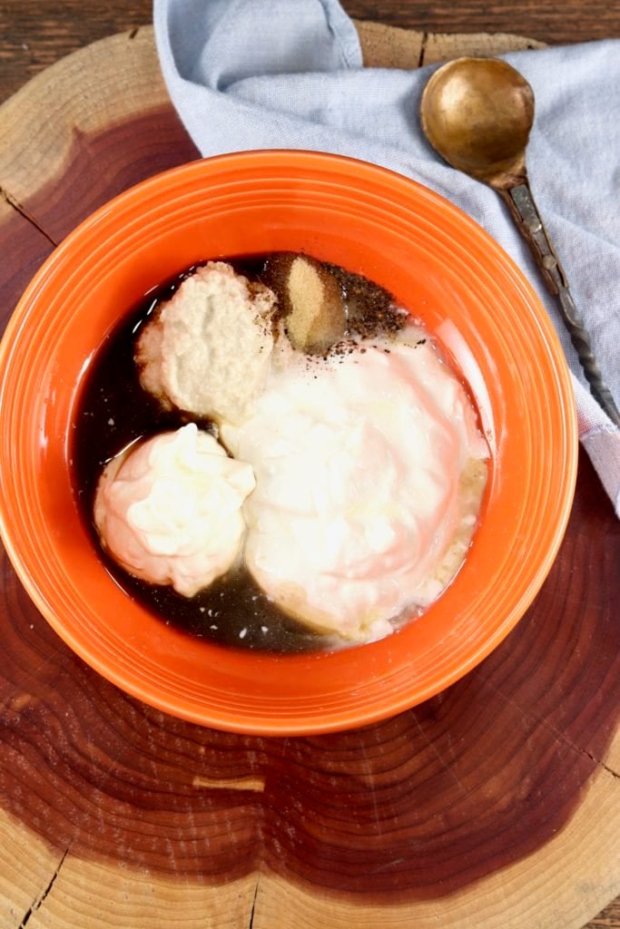 Ingredients for horseradish sauce in an orange bowl