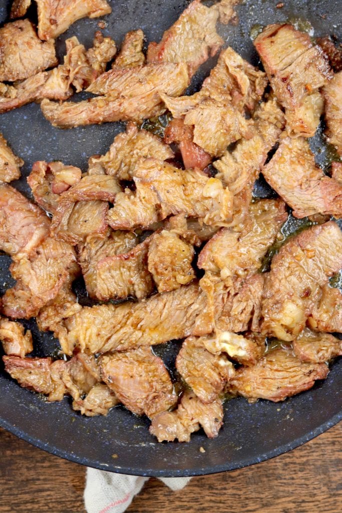 Thin sliced roast beef in a skillet