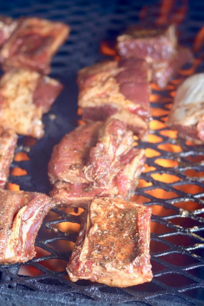 Beef ribs over grill fire