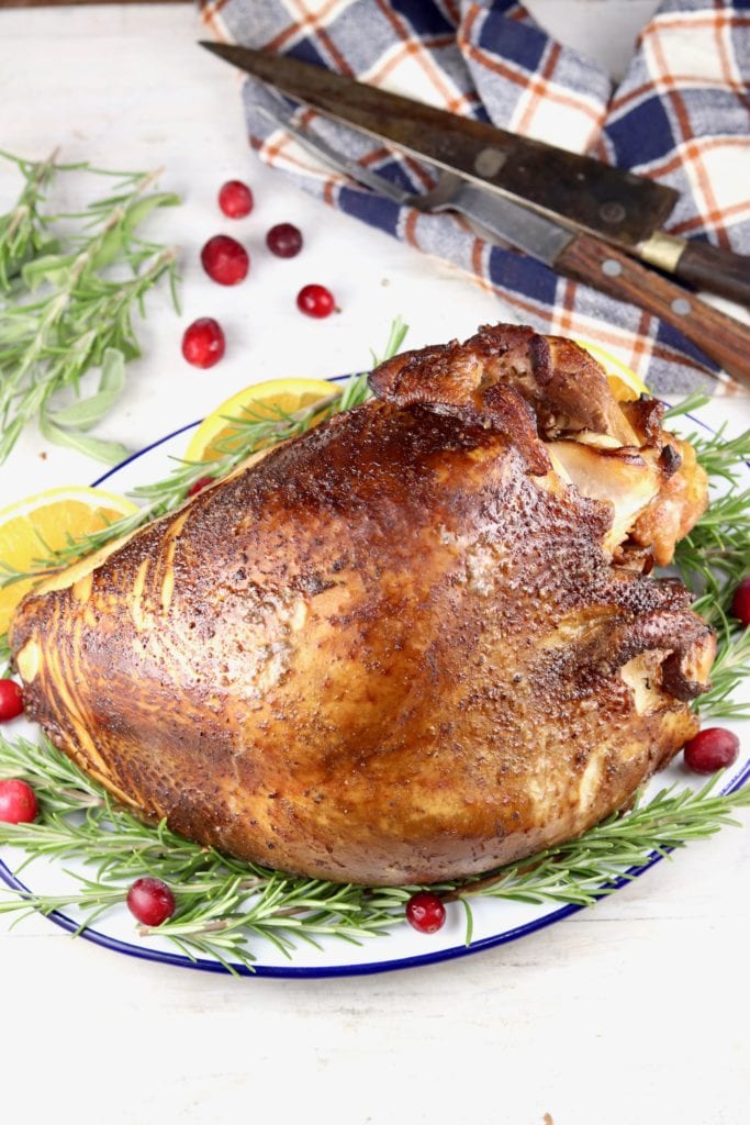 turkey breast smoked and served on a platter with fresh rosemary