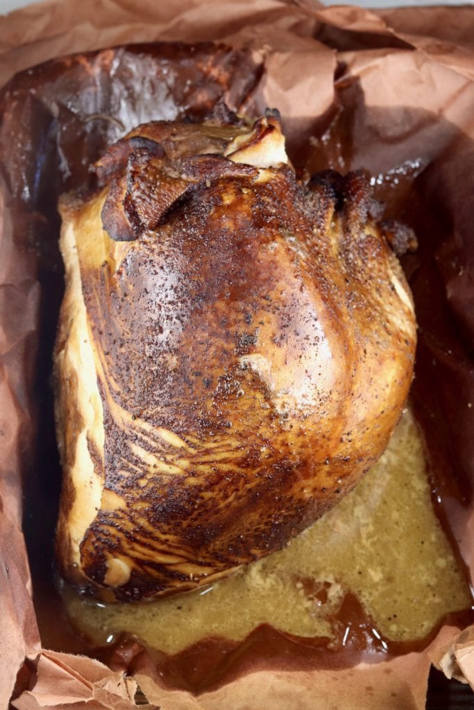 Smoked Turkey Breast and juices in pan with butcher paper