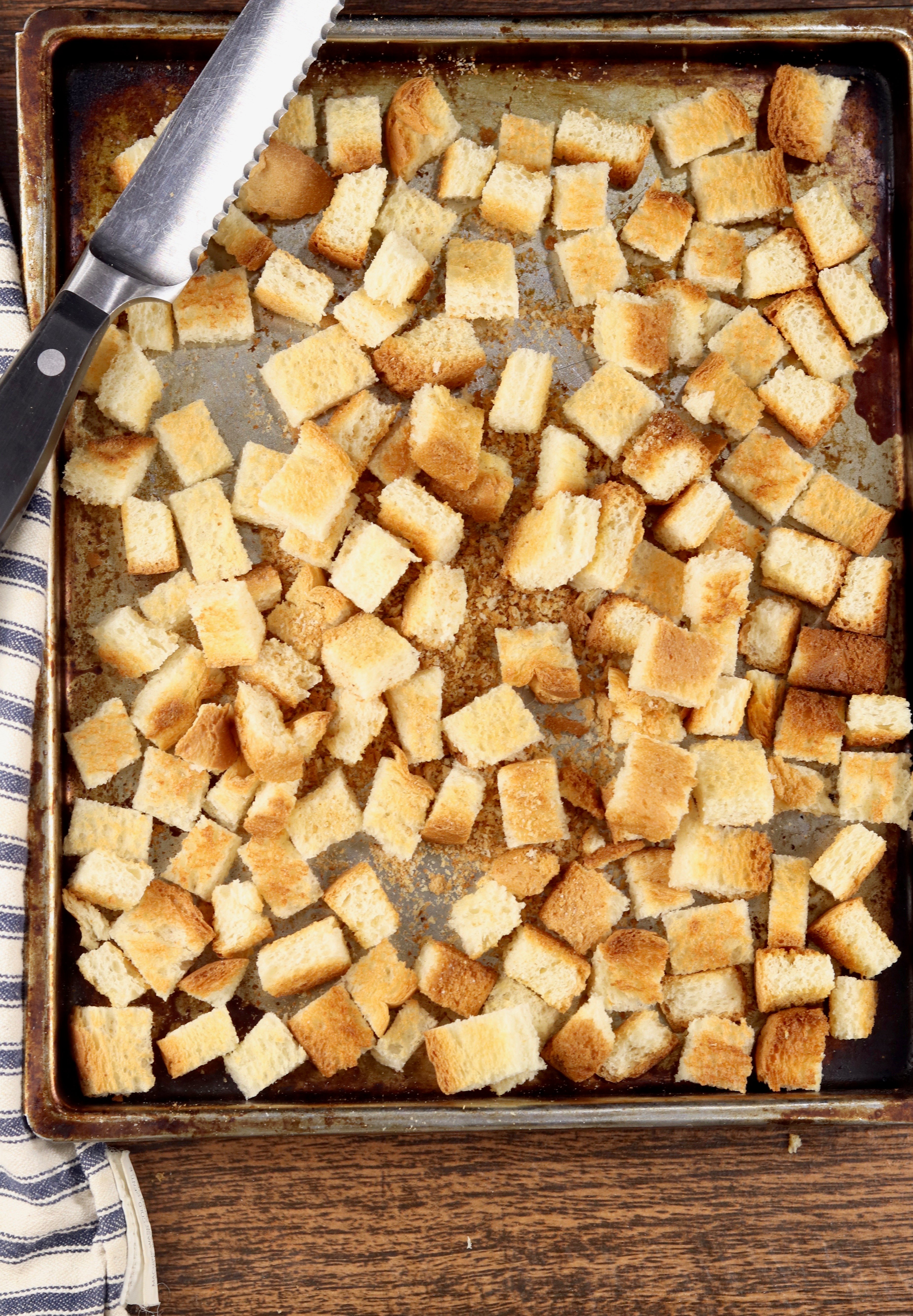 Toasted bread cubes on a sheet pan