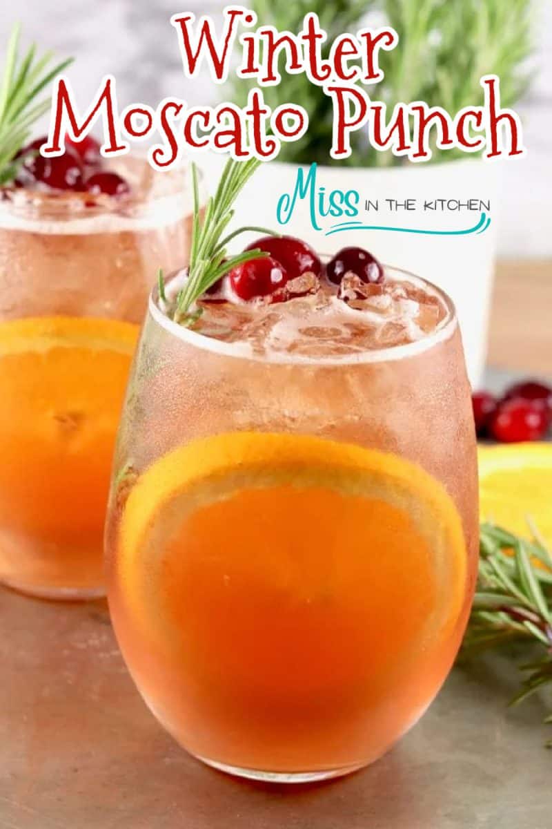 Winter moscato punch in 2 stemless wine glasses -text overlay.