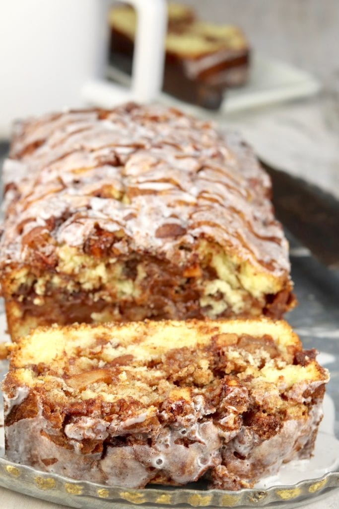 Close up of apple fritter loaf cake with slice