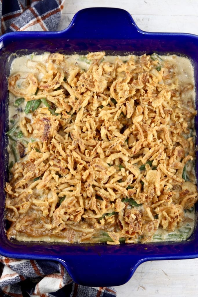 Blue casserole dish with green bean casserole
