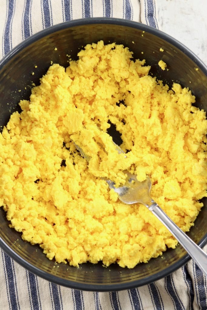 Egg Yolks in a bowl smashed with a fork
